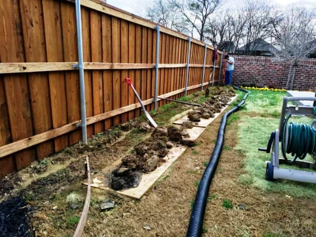 Installing landscape drainage system in Prosper Texas