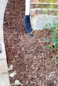 Installed gutter downspout drain pipe in Prosper Texas