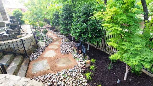 Layering landscaping plants to create a backyard retreat