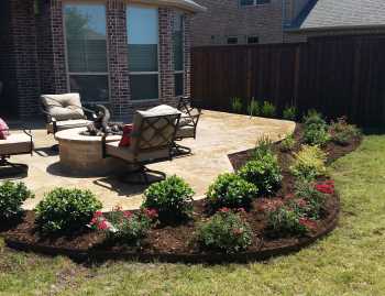 Outdoor Design Project Frisco After Outdoor Kitchen, Fire Pit and Landscape Bed Installation. Main Street Lawn Care and Landscaping best landscaping designers created a back yard oasis for this Frisco Texas homeowner.